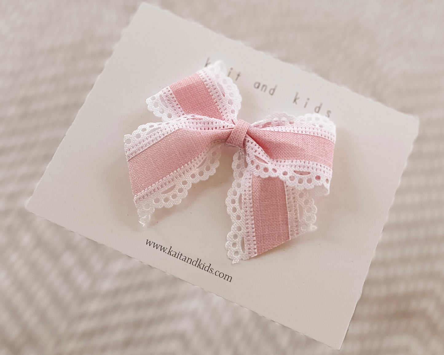 Scalloped baby pink and white